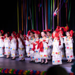 Ballet Folklorico dancers perform a recital on the stage.