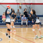Middle school volleyball playing a match.